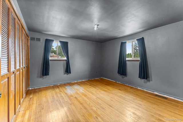 18607 Colonial Ct, Allen Park, MI 48101 - unfurnished room with hardwood / wood-style flooring, plenty of natural light, and baseboards