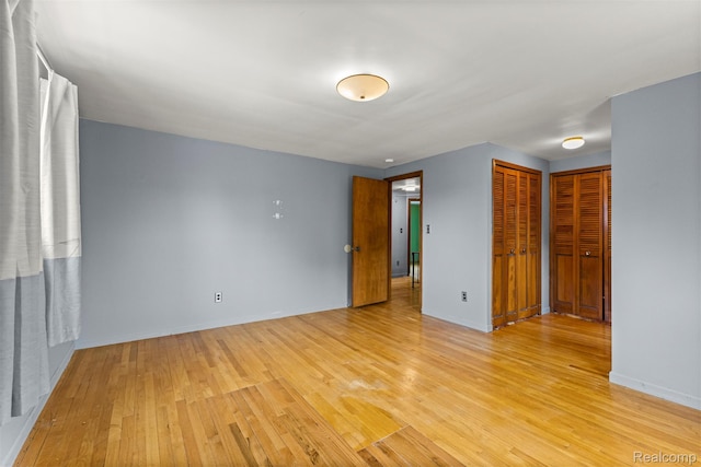 18607 Colonial Ct, Allen Park, MI 48101 - empty room with light wood-style floors and baseboards