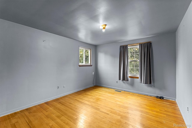 18607 Colonial Ct, Allen Park, MI 48101 - unfurnished room with wood-type flooring and baseboards