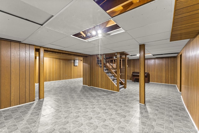 18607 Colonial Ct, Allen Park, MI 48101 - finished basement with wooden walls, stairs, and a paneled ceiling