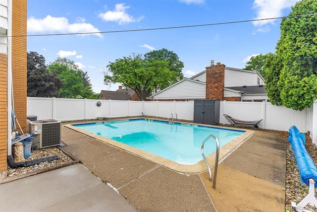 18607 Colonial Ct, Allen Park, MI 48101 - view of swimming pool with cooling unit, a fenced backyard, and a patio