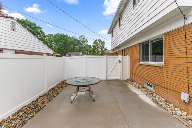 18607 Colonial Ct, Allen Park, MI 48101 - fenced backyard featuring a patio area and a gate