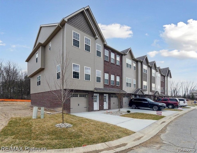 1685 Pinecroft Ln, Howell, MI 48855 - view of building exterior featuring an attached garage and a residential view