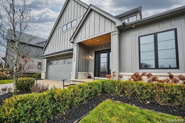 4174 Prescott Park Cir W, Bloomfield, MI 48323 - view of front of property featuring board and batten siding, concrete driveway, and stone siding