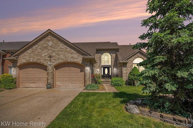 47040 W Wayford Dr, Shelby Twp, MI 48315 - french country style house with brick siding, a garage, driveway, a yard, and a shingled roof
