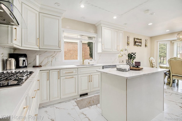 47040 W Wayford Dr, Shelby Twp, MI 48315 - kitchen featuring under cabinet range hood, a sink, light marble finish floors, stainless steel gas stovetop, and recessed lighting