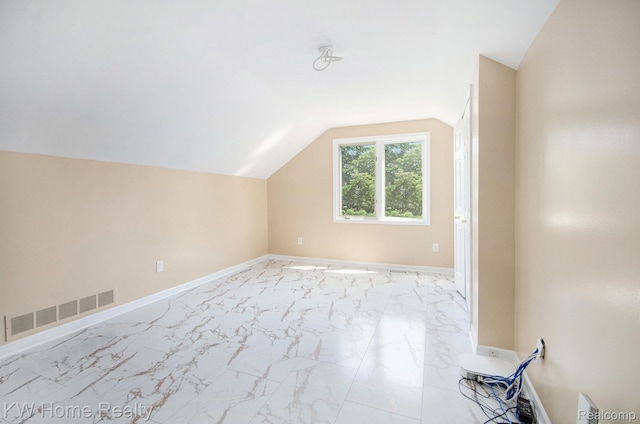 47040 W Wayford Dr, Shelby Twp, MI 48315 - bonus room with lofted ceiling, light marble finish floors, and baseboards