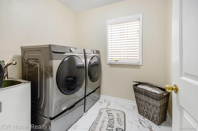 47040 W Wayford Dr, Shelby Twp, MI 48315 - laundry room with separate washer and dryer, marble look tiles, and baseboards