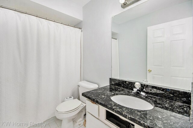 47040 W Wayford Dr, Shelby Twp, MI 48315 - full bathroom with vanity, toilet, and tile patterned floors