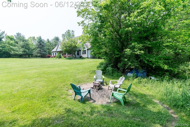 10399 Allen Rd, Clarkston, MI 48348 - view of green lawn with a fire pit