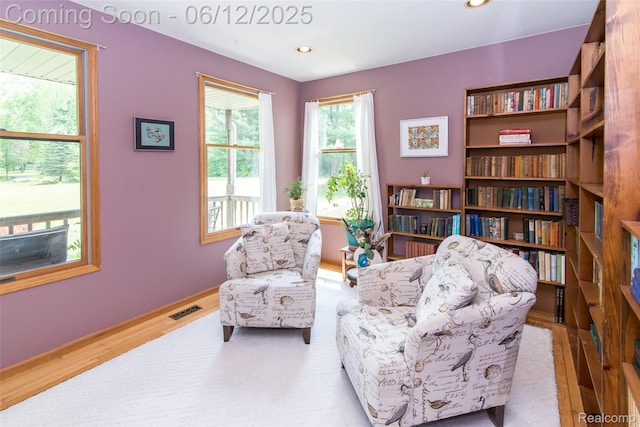 10399 Allen Rd, Clarkston, MI 48348 - living area featuring wood finished floors, recessed lighting, and baseboards