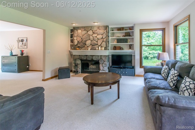 10399 Allen Rd, Clarkston, MI 48348 - carpeted living room featuring baseboards, a fireplace, and built in features