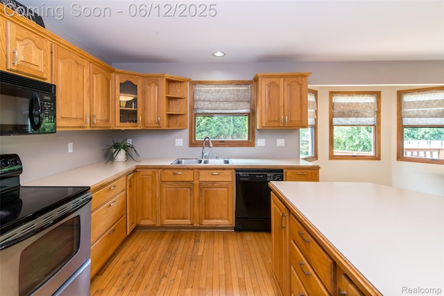 10399 Allen Rd, Clarkston, MI 48348 - kitchen featuring black appliances, a sink, healthy amount of natural light, light countertops, and recessed lighting