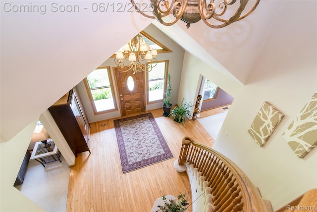 10399 Allen Rd, Clarkston, MI 48348 - entrance foyer with a chandelier and wood finished floors