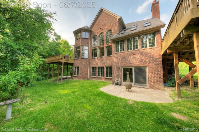 4546 Forest Edge Ln, West Bloomfield, MI 48323 - rear view of property featuring brick siding, a yard, a chimney, a patio, and a deck