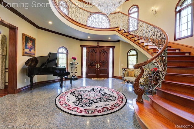 4546 Forest Edge Ln, West Bloomfield, MI 48323 - entryway with baseboards, granite floors, a high ceiling, plenty of natural light, and ornamental molding