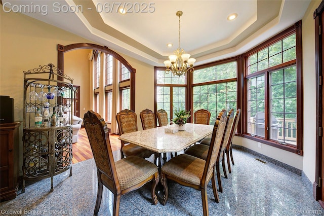 4546 Forest Edge Ln, West Bloomfield, MI 48323 - dining room featuring a chandelier, a raised ceiling, plenty of natural light, and recessed lighting
