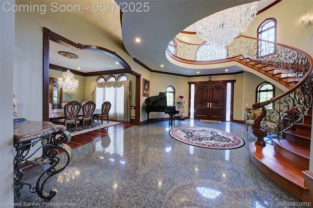4546 Forest Edge Ln, West Bloomfield, MI 48323 - entryway featuring a chandelier, crown molding, baseboards, stairs, and a high ceiling