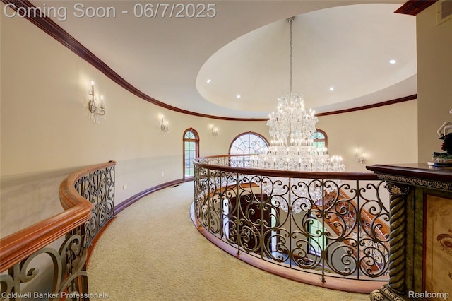 4546 Forest Edge Ln, West Bloomfield, MI 48323 - hall featuring a chandelier, crown molding, carpet flooring, baseboards, and a tray ceiling