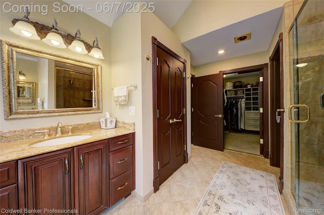 4546 Forest Edge Ln, West Bloomfield, MI 48323 - full bathroom with vanity, a shower stall, and a spacious closet
