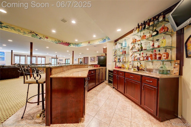4546 Forest Edge Ln, West Bloomfield, MI 48323 - indoor wet bar with recessed lighting, beverage cooler, and light tile patterned floors
