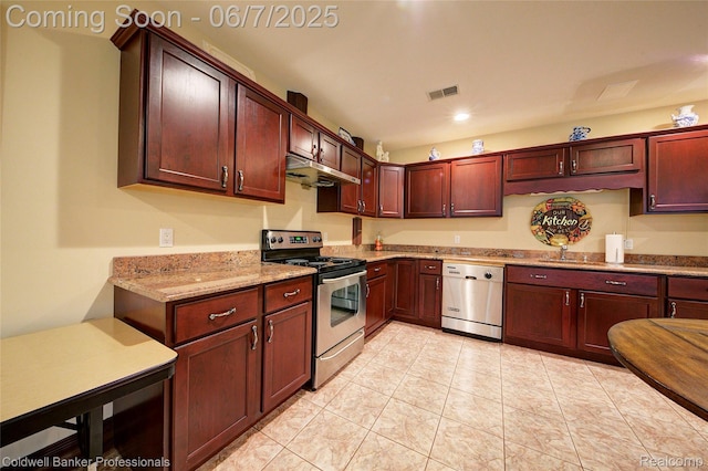4546 Forest Edge Ln, West Bloomfield, MI 48323 - kitchen with appliances with stainless steel finishes, under cabinet range hood, light stone counters, a sink, and recessed lighting