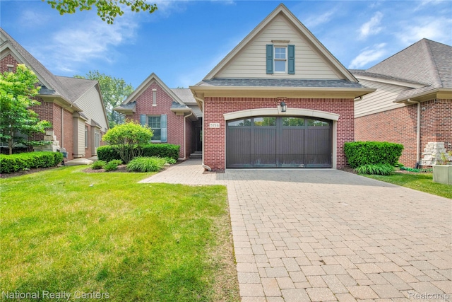 5716 Pembrooke Xing, West Bloomfield, MI 48322 - traditional home featuring decorative driveway, brick siding, a front yard, a shingled roof, and an attached garage