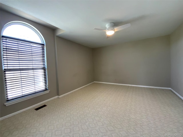 3577 Oakmonte Blvd, Rochester, MI 48306 - unfurnished room with a ceiling fan, carpet, and baseboards