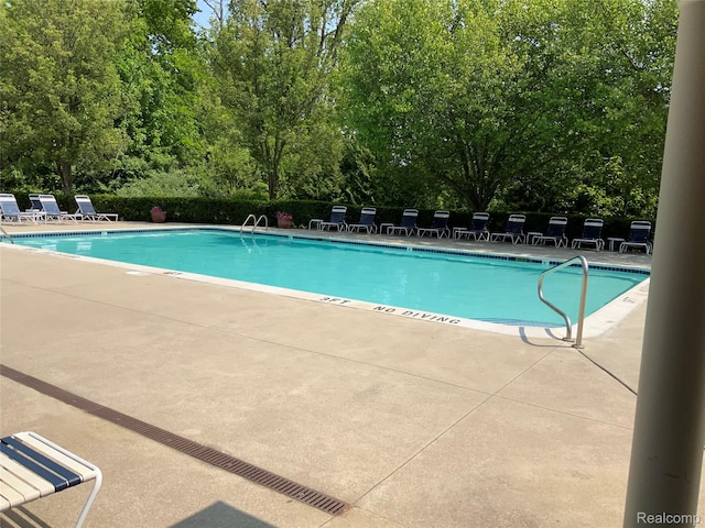 3577 Oakmonte Blvd, Rochester, MI 48306 - community pool with a patio area and view of scattered trees