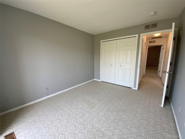 3577 Oakmonte Blvd, Rochester, MI 48306 - unfurnished bedroom with light colored carpet, baseboards, and a closet