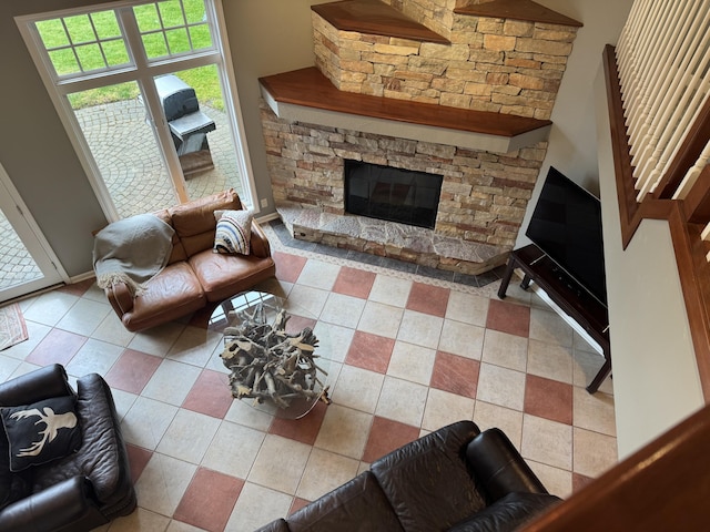 371 Waukazoo Dr, Holland, MI 49424 - living room with tile patterned flooring and a stone fireplace