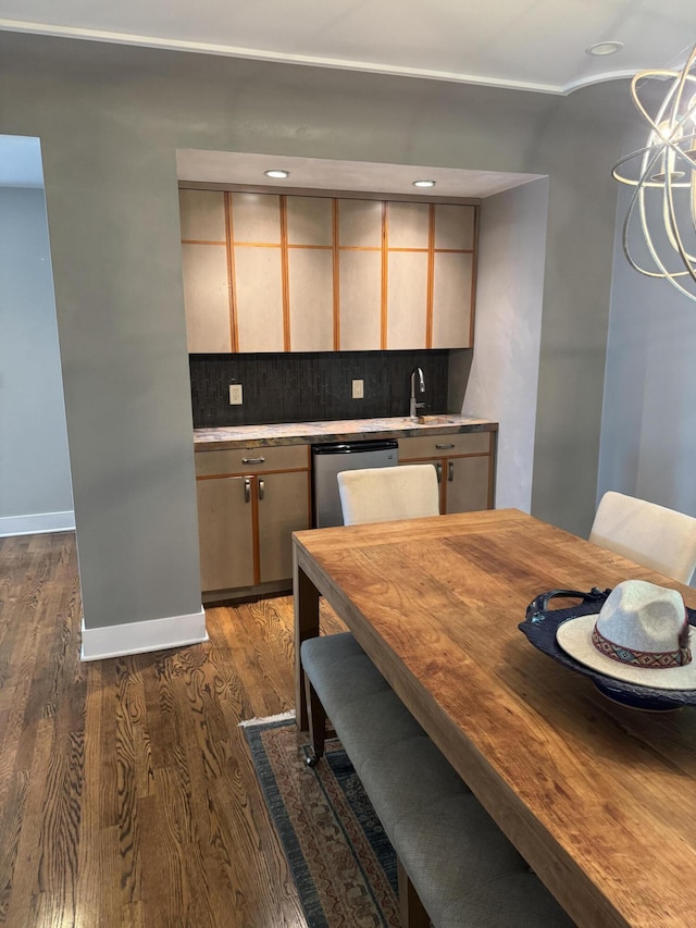 371 Waukazoo Dr, Holland, MI 49424 - kitchen featuring stainless steel dishwasher, dark wood-style flooring, backsplash, and light countertops