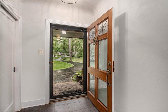 371 Waukazoo Dr, Holland, MI 49424 - entryway with baseboards and tile patterned floors