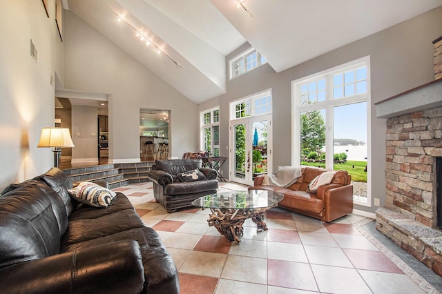 371 Waukazoo Dr, Holland, MI 49424 - living room with high vaulted ceiling and tile patterned flooring