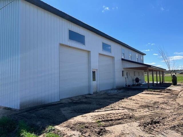 5195 Chief Rd, Brethren, MI 49619 - view of side of home with a garage