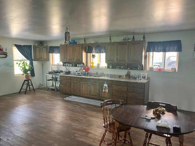 5195 Chief Rd, Brethren, MI 49619 - kitchen featuring dark wood-style flooring and light countertops
