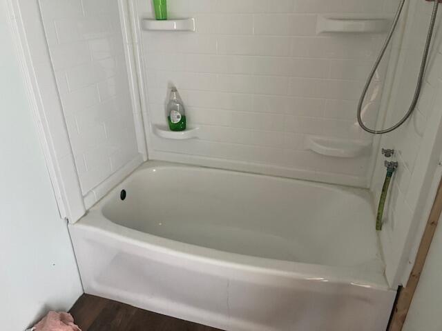 5195 Chief Rd, Brethren, MI 49619 - full bath with wood finished floors and bathing tub / shower combination