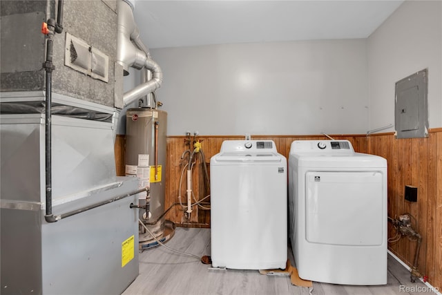 27048 Sally Ct, Taylor, MI 48180 - laundry area featuring electric panel, washer and dryer, gas water heater, wainscoting, and wood walls