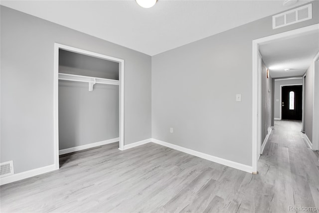 27048 Sally Ct, Taylor, MI 48180 - unfurnished bedroom featuring wood finished floors, baseboards, and a closet