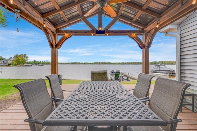 4805 Pinellas Dr, Hale, MI 48739 - deck featuring a water view, a ceiling fan, outdoor dining space, and a gazebo