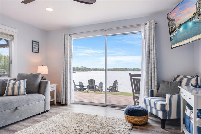 4805 Pinellas Dr, Hale, MI 48739 - living room with ceiling fan, a water view, wood finished floors, and recessed lighting