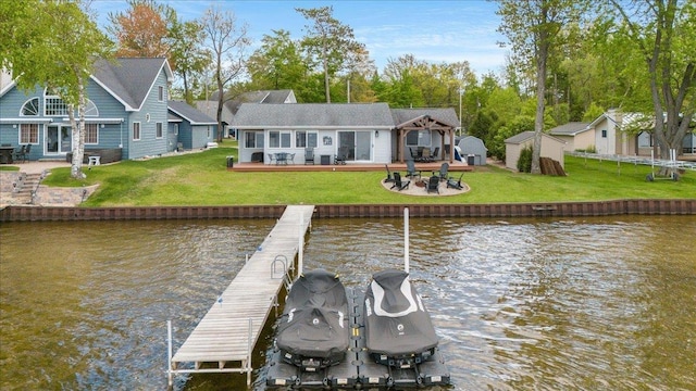 4805 Pinellas Dr, Hale, MI 48739 - dock area with a water view, a lawn, a patio area, and a fire pit