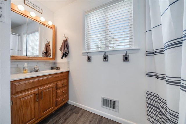 4805 Pinellas Dr, Hale, MI 48739 - full bathroom with plenty of natural light, vanity, wood finished floors, and baseboards