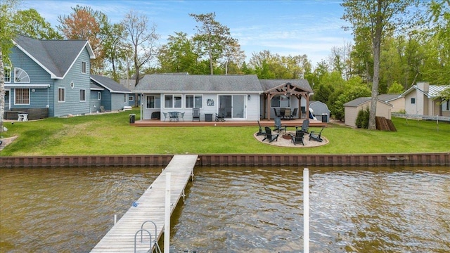 4805 Pinellas Dr, Hale, MI 48739 - rear view of house featuring a deck with water view and a lawn