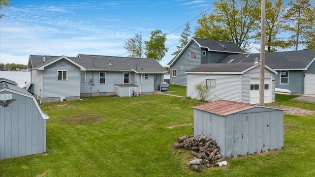 4805 Pinellas Dr, Hale, MI 48739 - rear view of property with a garage and a lawn