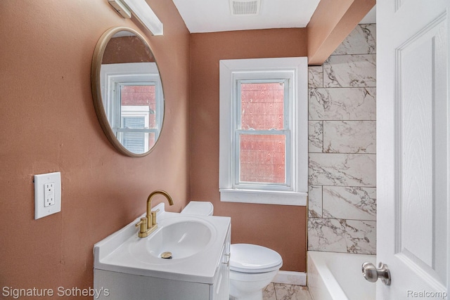 16762 Woodingham Dr, Detroit, MI 48221 - full bath with marble look tiles, vanity, toilet, and baseboards