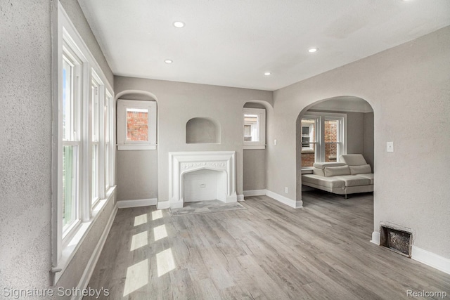 16762 Woodingham Dr, Detroit, MI 48221 - unfurnished living room with wood finished floors, baseboards, healthy amount of natural light, and recessed lighting