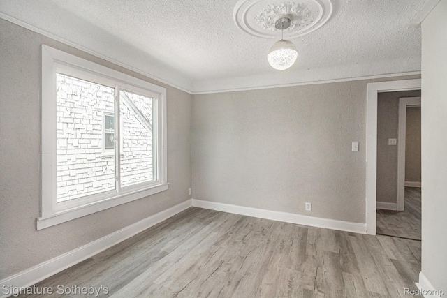 16762 Woodingham Dr, Detroit, MI 48221 - unfurnished room featuring wood finished floors, a textured ceiling, and baseboards