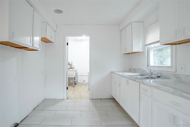 16131 Lenore, Detroit, MI 48219 - kitchen with a sink and white cabinets