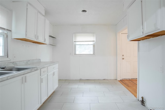 16131 Lenore, Detroit, MI 48219 - kitchen featuring light countertops and white cabinets